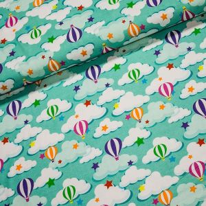 Bavlněný úplet dětský 88880702 létající balóny na zelené, š.150cm (látka v metráži)